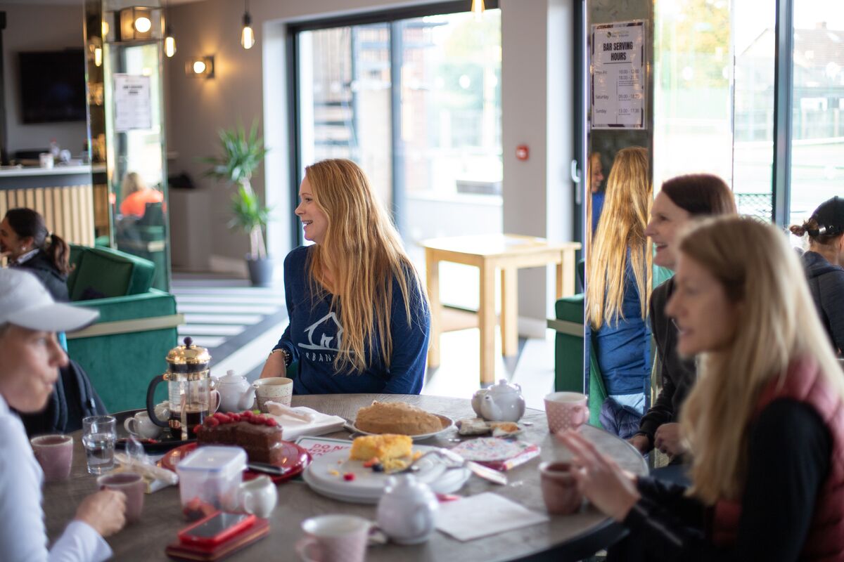 Members chatting over tea and cake in the Hidden Gem